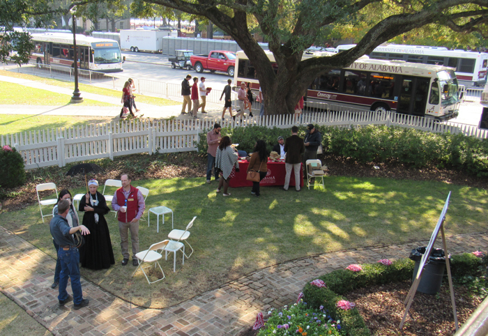 a group of people standing in the yard of the Gorgas House